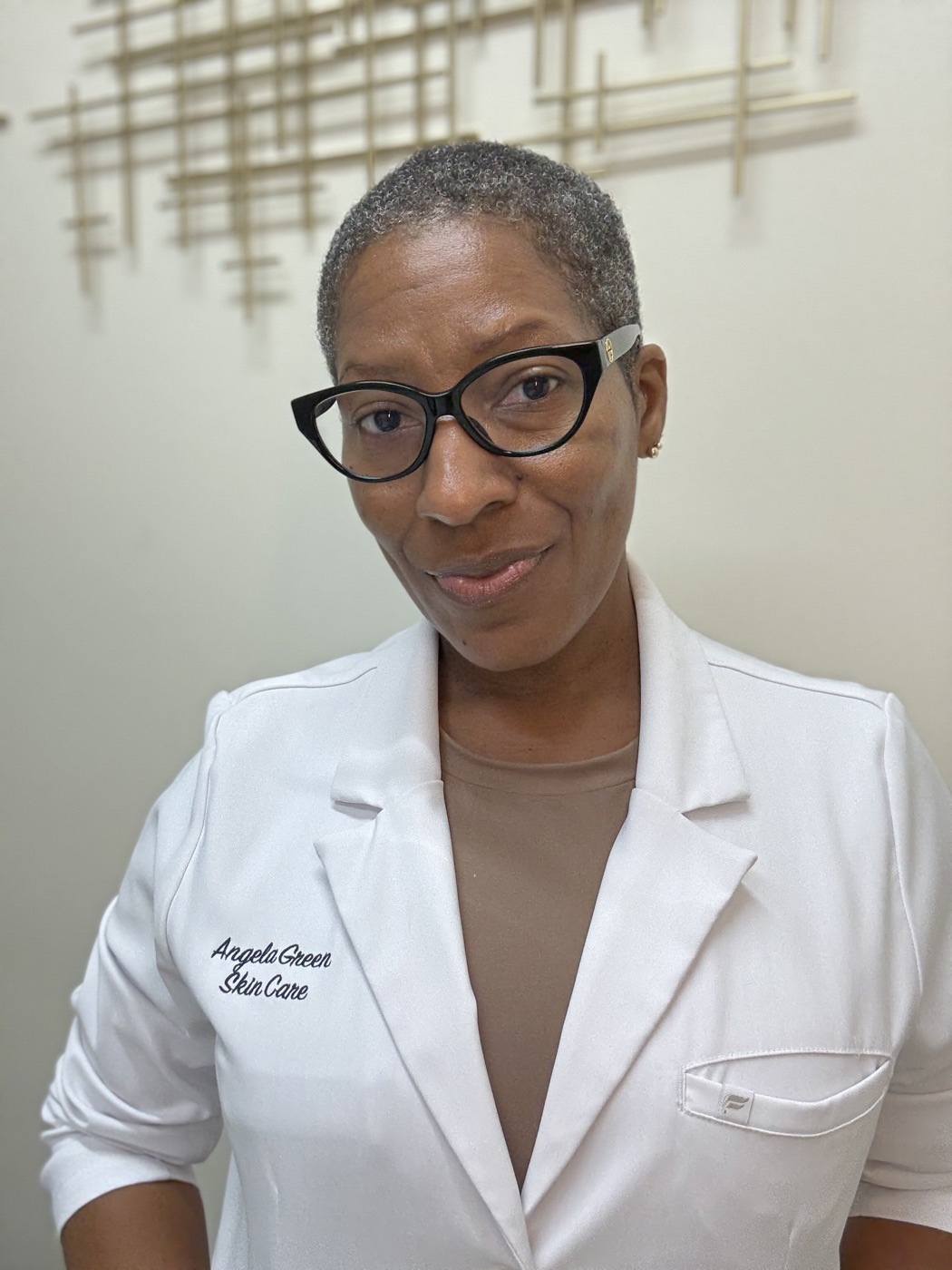 Angela Green, licensed esthetician, in her white coat