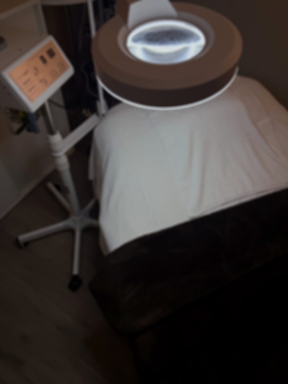 The treatment bed and magnifier lamp in Angela's studio