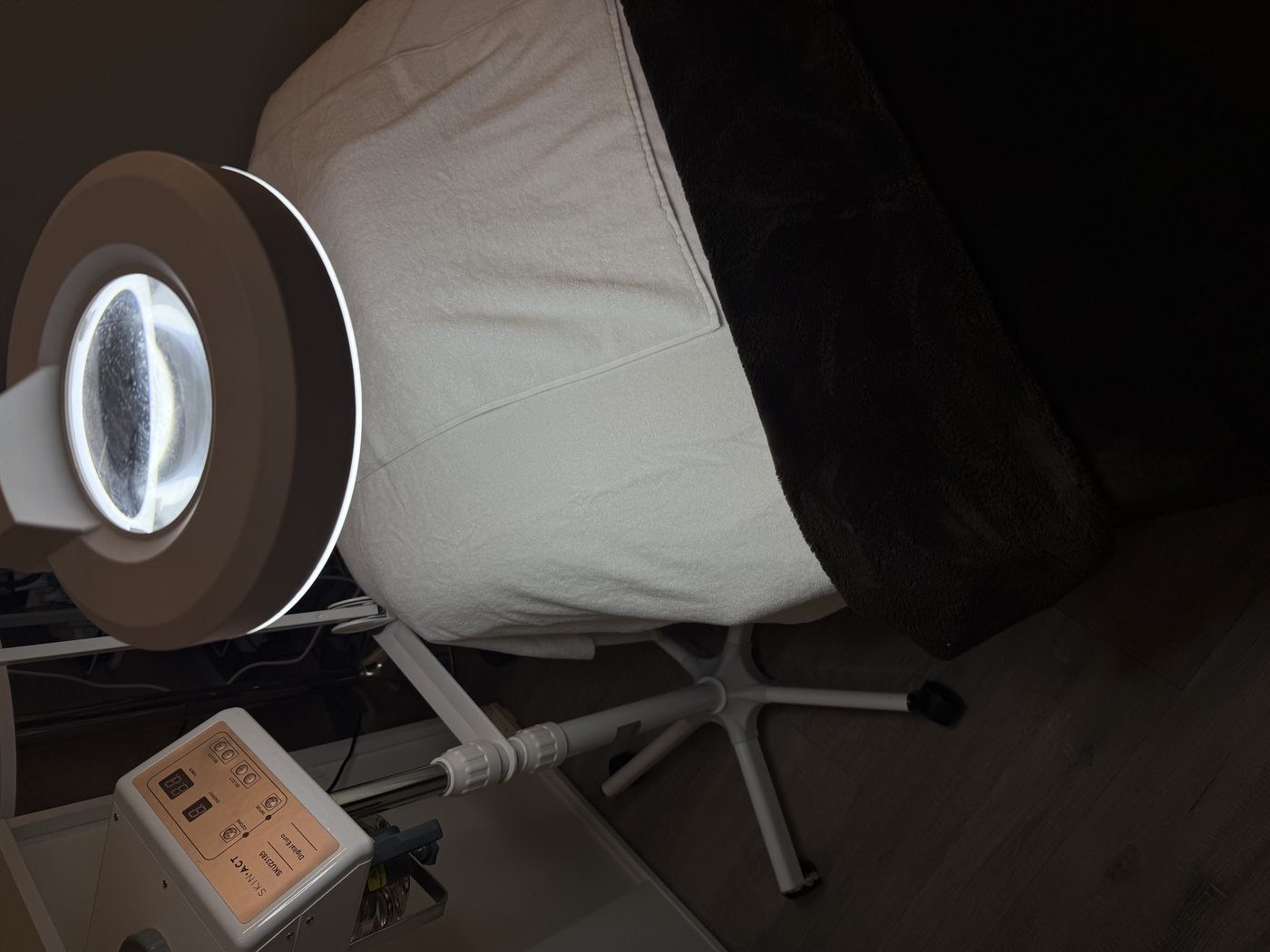 The treatment bed and magnifier lamp in Angela's studio